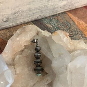 Navajo saucer sterling is Silver pendant